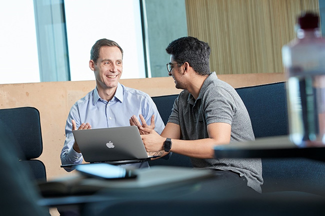 Dr Frederik Von Briel talking with a student. 