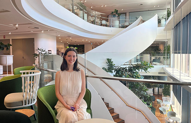 UQ Student in a modern office on placement at Queensland Treasury