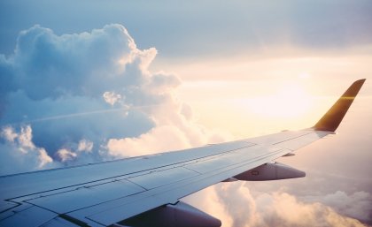 This is an image of a plane flying through the clouds