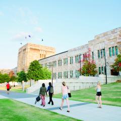This is an image of students walking past UQ's Forgan Smith building