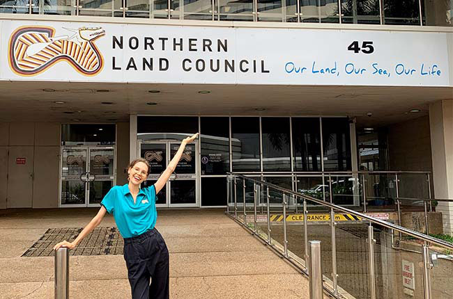 Anna out the front of her Aurora Internship Program internship, the Northern Land Council (NLC) in Darwin.