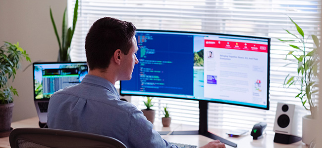 man at a computer working from home.