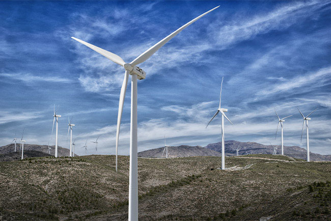 wind farm on a rolling empty plain