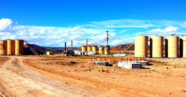 An unused refinery in a barren landscape