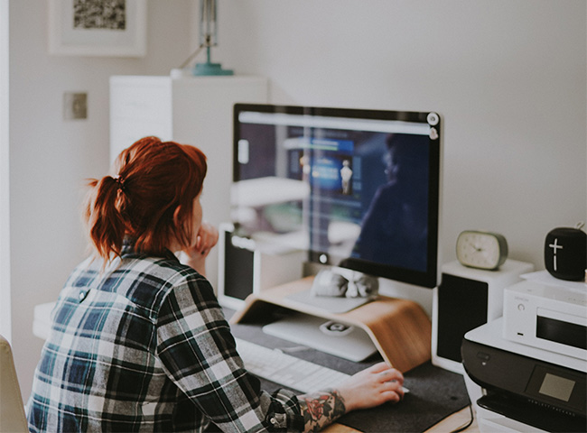 A young woman working at a computer