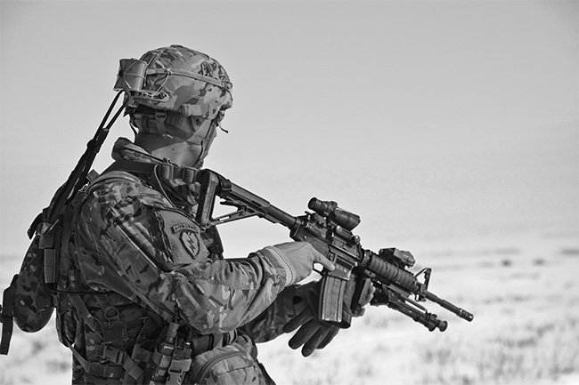 Black and white picture of American soldier looking into the distance.