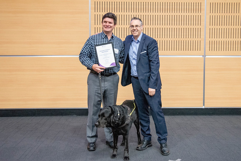 Associate Professor Paul Harpur with his guide dog Sean and Professor Brent Ritchie