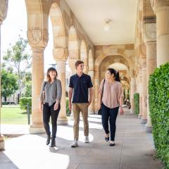 Three Frank Finn Scholarship recipients walking through the Great Court
