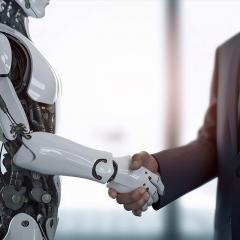 Man shaking a robots hand 