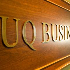 Wooden UQ Business School sign