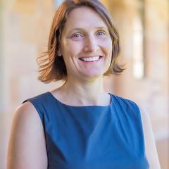 Profile photo of Dr Andrea La Nauze standing in UQ's Great Court