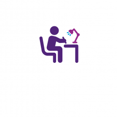 Student studying at desk icon 